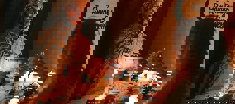 Invalidators of Fasting in Ramadan Couple sitting at a dining table during the holy month of Ramadan