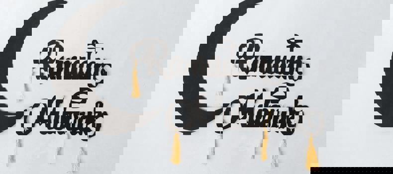 Giving sadaqah last 10 days of ramadan gift wrapped with a red ribbon