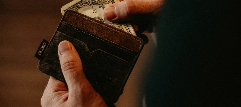 Man taking money out of his wallet