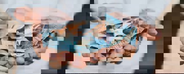 A man holding some money with open hands