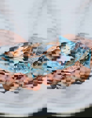 A man holding some money with open hands